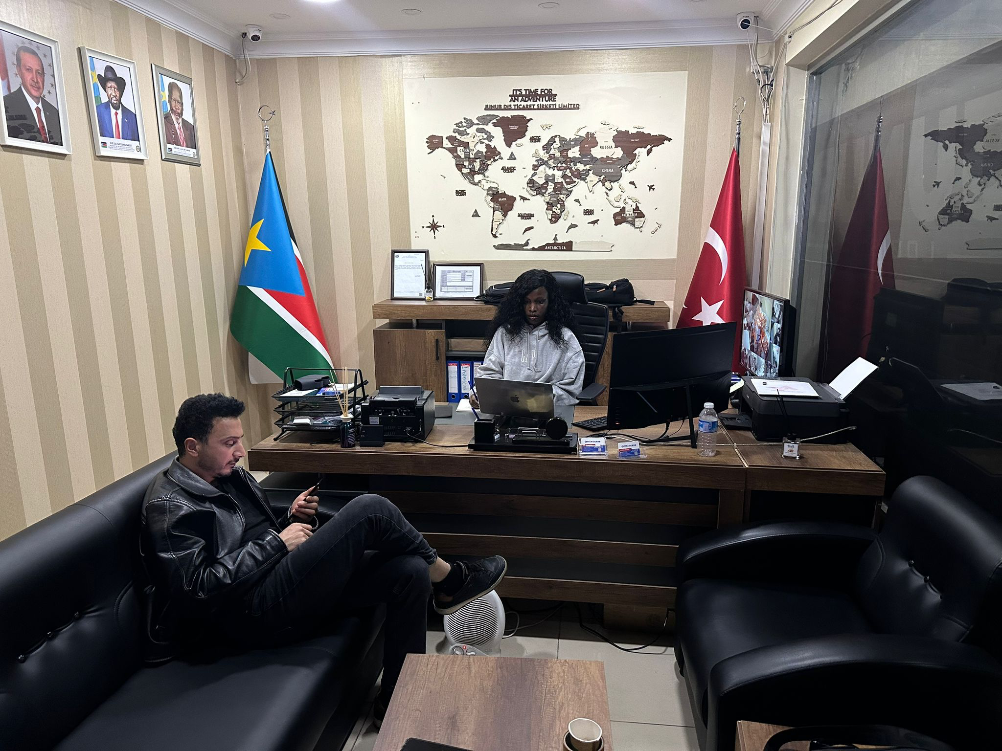 Cargo ship loaded with containers at port sunset